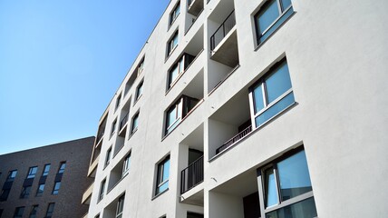 Multistoried modern, new and stylish living block of flats. Newly built apartment building.