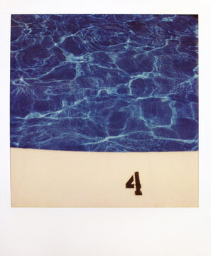 Polaroid Photograph Of A Vibrant Blue Swimming Pool