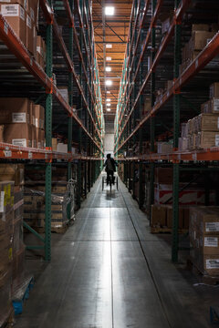 Worker in distribution warehouse