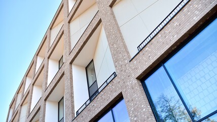 Multistoried modern, new and stylish living block of flats. Newly built apartment building.