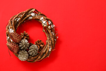 Beautiful Christmas wreath on color background