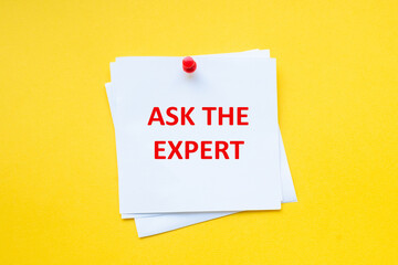 Ask the expert. Time to adapt. Word on white sticker with yellow background