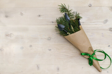 Christmas gardening tools on white wooden table. Top view, flat lay