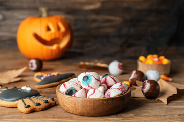 Tasty treats for Halloween on table