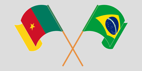Crossed and waving flags of Cameroon and Brazil