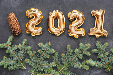 Figure 2020 made of balloons and Christmas decor on dark background