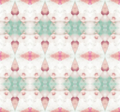 Pale pink and teal graphic pattern made by glass pebbles inside kaleidoscope