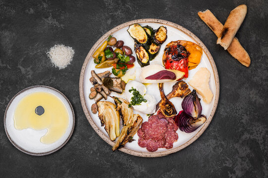 Italian appetiser plate with bread and olive oil