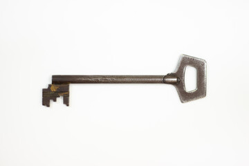Ancient keys, used for long time. Vintage key on white background. Old key isolated. Keys on table. 
