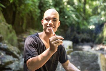 Man performing RapÔøΩÔøΩ in the jungle