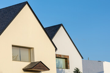 Perspective view at sunset of Alpine style houses with slate roofs in Granada (Spain)