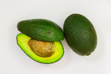 Open avocado on a white background. Avocado macro. Close up of an avacado. Avocado isolated on white background.