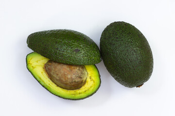 Open avocado on a white background. Avocado macro. Close up of an avacado. Avocado isolated on white background.