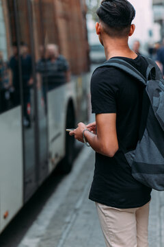 Man looking for public transportation