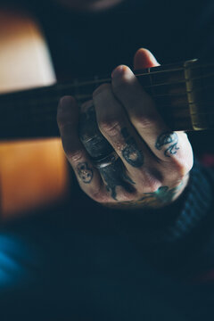 Musician playing and recording at home.