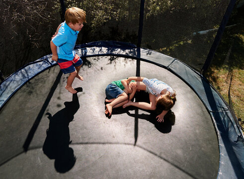 Aerial View of Kids in Backyard Trampoline