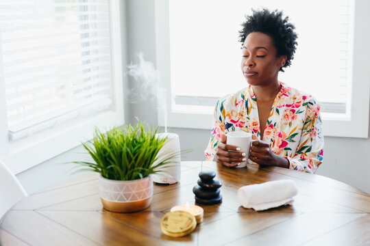 Black Woman Relaxing And Meditating At Home