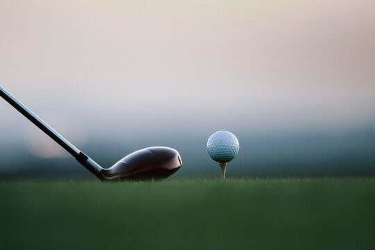 Golf Ball on Tee at Dawn with Driver Club
