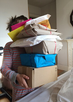Boy carrying presents