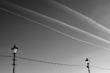 A pattern of contrails, cables and lanterns over Penarth, Wales, UK