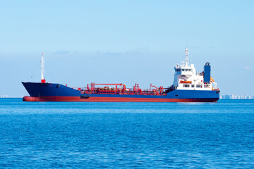 Tanker on the ocean backdrop. Chemical tanker is sailing on sea. Ship for transportation of...