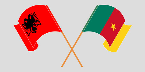 Crossed and waving flags of Cameroon and Albania