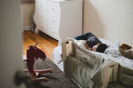 Little kid passed out in bed