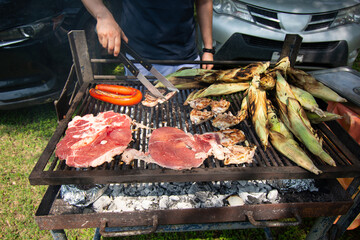 Grilling Beef, Polish Sausage, and Corn on the Grill - obrazy, fototapety, plakaty