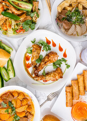 Vegan Vietnamese chicken wings made with seitan. Traditional dishes from Vietnam made vegan without real meat using vegetables and meat-substitutes. Meat-free bahn mi, egg rolls, and soup.