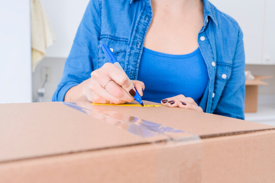 Writing a Label onto a Moving Box