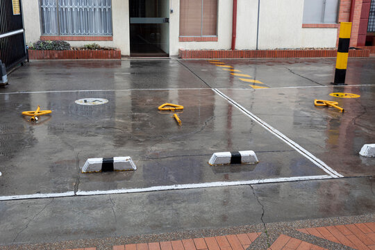 A residential unit parking at rany day. Traffic, building and wheater concept