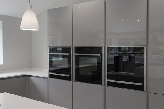 Contemporary kitchen units with integrated appliances.