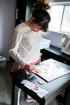 Autistic child solving a puzzle
