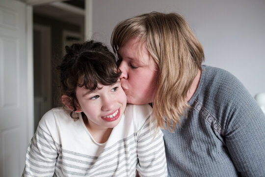 Portrait of an autistic child with her therapist