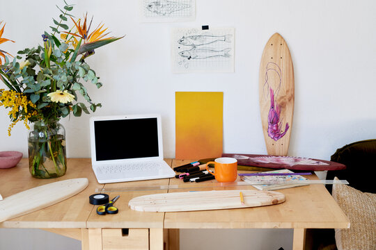 Tidy workplace with longboard templates.