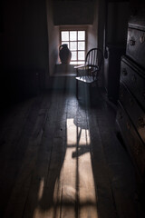 Old farmhouse interior with period furniture and natural lighting, Cardiff, Wales