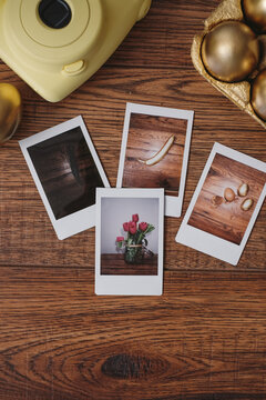 Polaroid Pictures on a Table