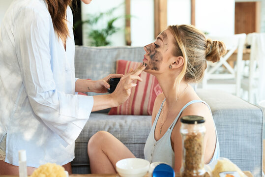 Woman getting skin care from beautician.