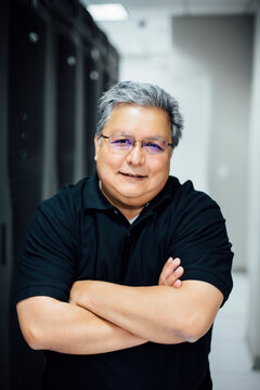 Handsome IT Hispanic Computer Expert in Server Room