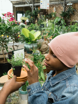 Mother and son shopping for plants and herbs
