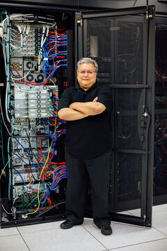 IT programmer working on equipment in server room