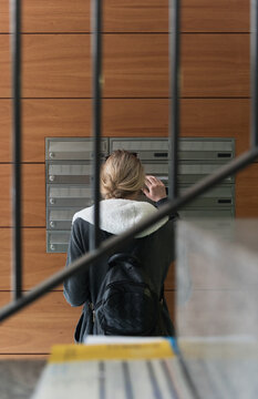 Woman standing at mailbox