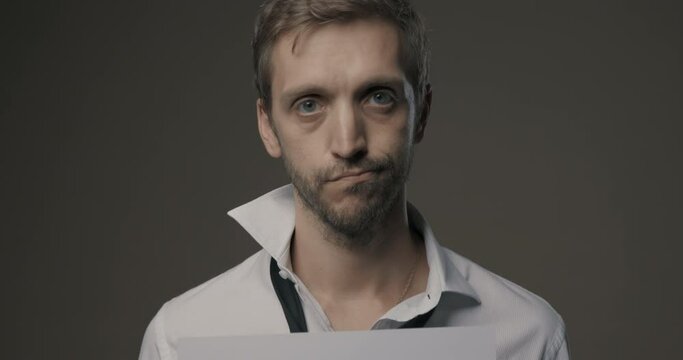 Businessman holding a negative financial chart