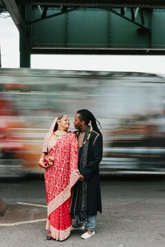 Bride and Groom on a Busy Street