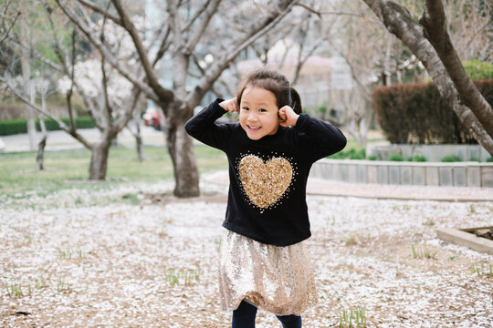 Adorable girl playing in park