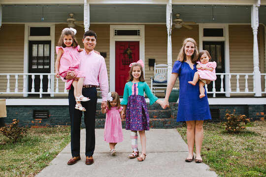 Happy Family in front of Home