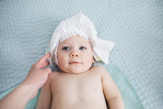 mom and baby playing games during a diaper change