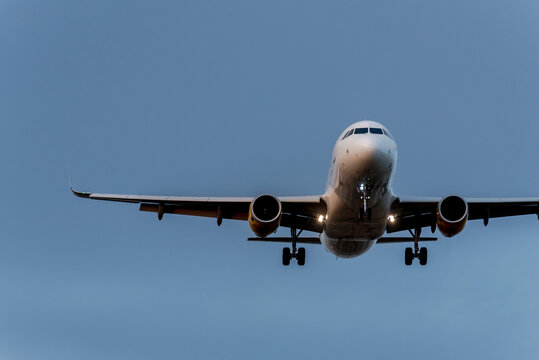 Flying airplane in blue sky