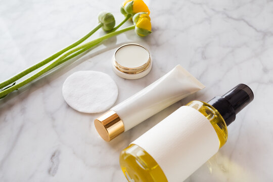 beauty and care products over marble