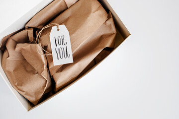 open gift box with a handwritten tag ""for you""